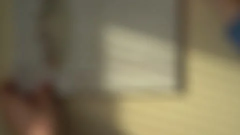 Close-up of Hands Hanging a Picture on the Wall. Blurred Video Video stock 150376744