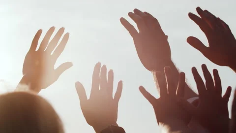 Close-up of the hands of a happy people reaching for the sun at sunset, in Video stock 235587091