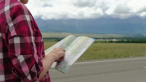 Close up hands of hiker looking for map route. Active lifestyle hiking enjoying Stock Footage 136496058