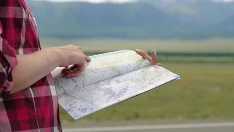 Close up hands of hiker looking for map route. Active lifestyle hiking enjoying Stock Footage 136990039