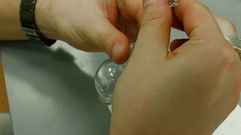 Close-up. Hands hold a flask and a syringe in the laboratory Stock Footage 82702514