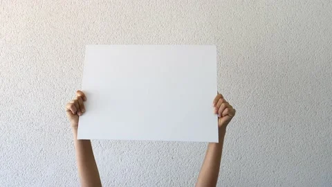 Close up of hands holding blank empty sign white board for promotional content Stock-Footage 131918142