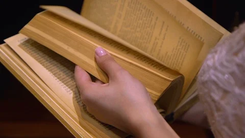 Close Up Of Hands Holding Book And Turning Pages Stock Footage 120147982