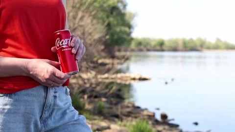 Close-up of hands holding a can of Coca-Cola Original Taste Stock-Footage 334792389