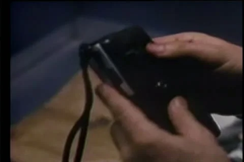 Close-up of hands holding a dictaphone 스톡 동영상 11350305