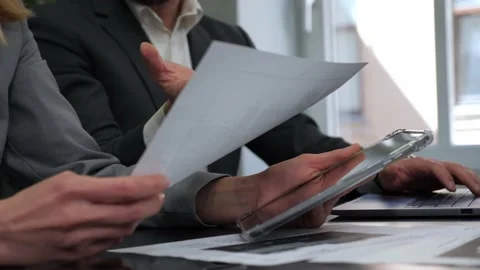 Close up hands holding documents, business people group meeting in office room. Video stock 195614697