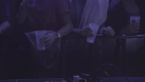 Close up of hands holding drinks while dancing at gig Stock-Footage 137309565