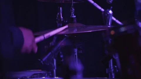 Close up of hands holding drumstick and playing drums in the club Stockbeeldmateriaal 80523964