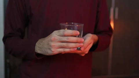 Close Up of Hands Holding Empty Drinking GlassClose Up of Hands Holding Empt Stock Footage 337847411