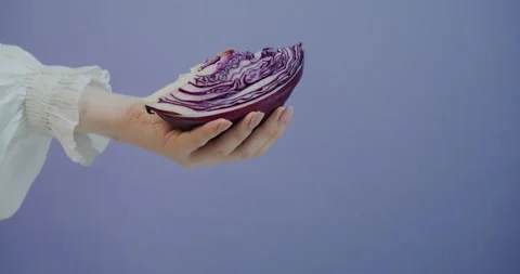 Close-Up of Hands Holding Fresh Red Cabbage Stock Footage 315787898
