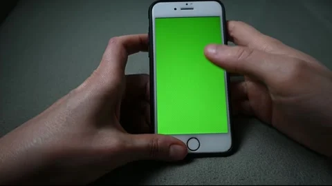Close-up of hands holding green screen chroma key phone and fingering. Stock Footage 170661630