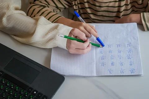 Close-Up of Hands Holding Pen and Notebook Stock Photos