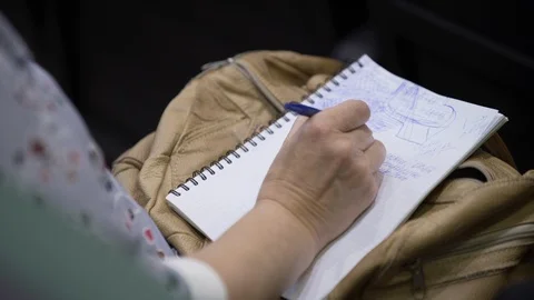 Close-up of Hands holding pens and making notes at the conference Stock Footage 117366146