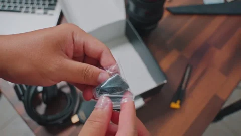 Close-up Hands Holding Small Bag of Tiny Electronic Components and Screws on Stock Footage 333320581
