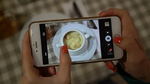 Close up of hands holding smartphone and taking photo of food for social Stock Footage 90207133