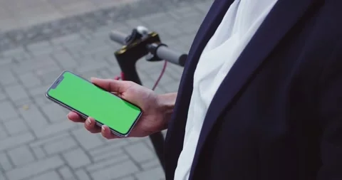 Close up of hands holding smartphone with chroma key. Businesswoman wearing Stock Footage 140105359