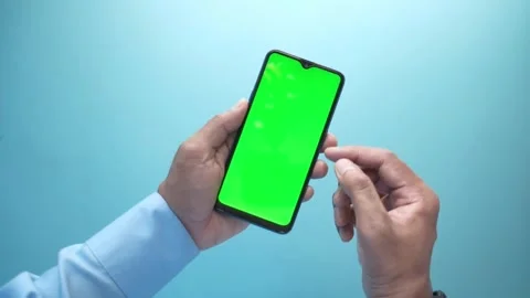Close-Up Hands Holding Smartphone with Green Screen Mockup Animation Stock Footage 332813764
