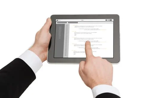 Close up of hands holding tablet pc with coding Stock Photos