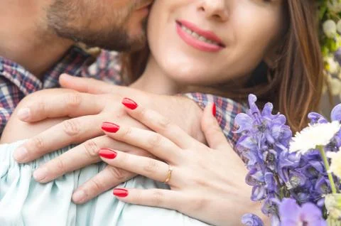 Close-up of a hands hugging couple of guy and his girlfriend Stock Photos