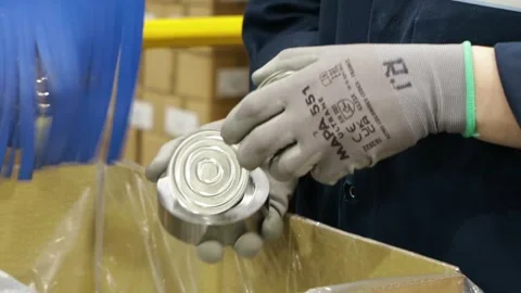 Close up on hands inspecting caps in a factory Stock Footage 274737945