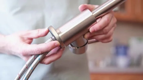 Close-up of hands with a kitchen faucet Stock Footage 304433215