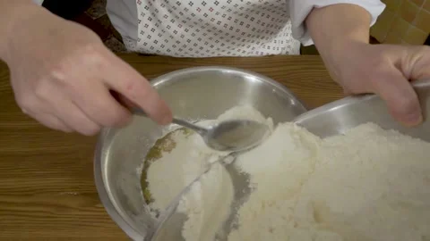 Close - up hands knead the dough on the table at home. Close-up of a woman with Stock Footage 140060029