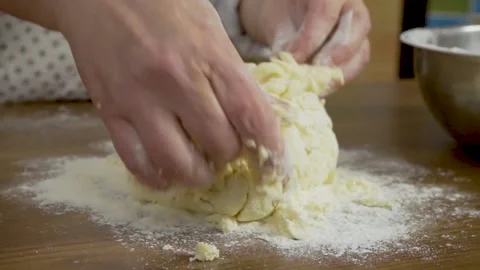 Close - up hands knead the dough on the table at home. Close-up of a woman with Stock Footage 140060059