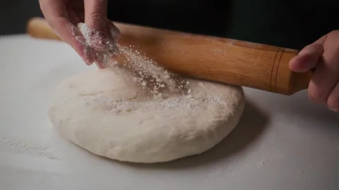 Close-up of hands kneading dough with rolling pin Vídeo Stock 336095824