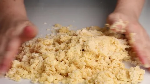 Close-up of hands kneading dough on a white surface. Baking and cooking pro.. Stock Footage 303589542