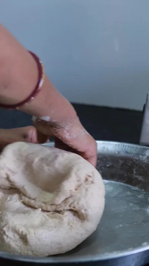 Close-up of Hands Kneading Fresh Wheat Dough in a Steel Plate Video stock 331354701