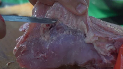 Close-up. hands with a knife cut a piece of meat. cut fat from meat Stock Footage 113271403