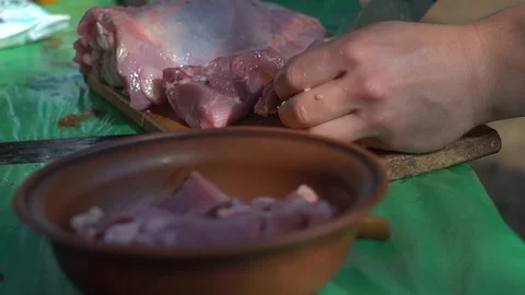 Close-up. hands with a knife cut a piece of meat. cuts meat into small pieces. Stock Footage 113272702