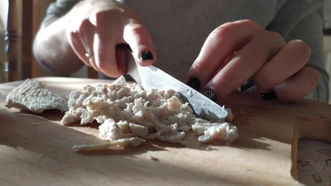 Close-up. hands with a knife. cutting boiled meat into small pieces. salad Video stock 121003120