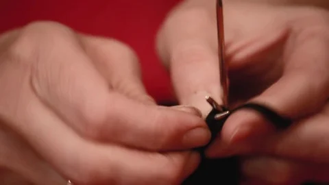 Close-up hands with knitting needles, beautiful woman knits Stock Footage 84842270