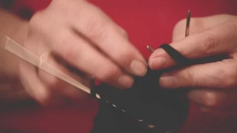 Close-up hands with knitting needles, beautiful woman knits Stock Footage 84842597