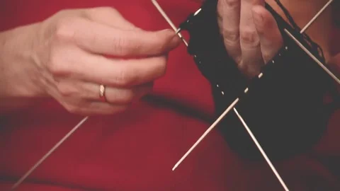 Close-up hands with knitting needles, beautiful woman knits Stock Footage 84842905