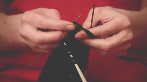 Close-up hands with knitting needles, beautiful woman knits Stock Footage 84843505