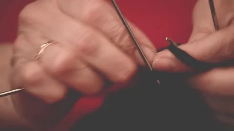 Close-up hands with knitting needles, beautiful woman knits Stock Footage 84843949