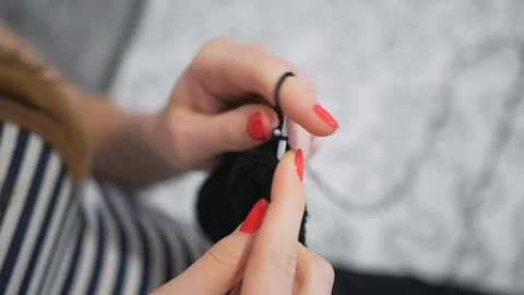 Close-up hands with knitting needles, beautiful pregnant woman knits Stock Footage 104022866