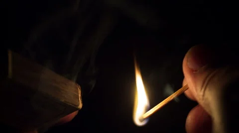 Close-up of hands lighting a match . Stock Footage