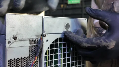 Close-Up of Hands Maintaining BTC Mining Machine with Precision Stock Footage 327371485