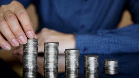 Close-up hands make up stacks of coins. Stock Footage 129175300