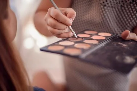 Close-up of hands with makeup palette Stock Photos