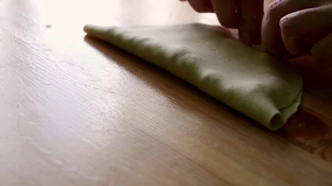 Close-up hands making chebureks. Preparing meat pies Stock Footage 177932558
