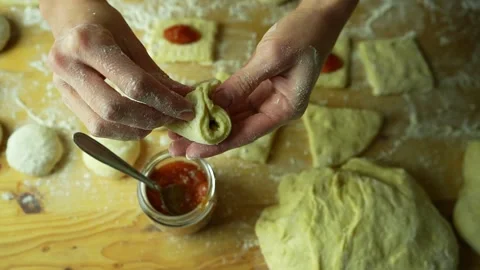 Close up hands making donuts filled with jam. Stock-Footage 220450988