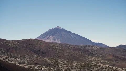 Close up of hands making frame gesture. Misty valley bellow rocky peak.  Stock Footage 102636117