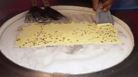 Close-up hands making ice cream in the street of Thailand Video stock 199023029