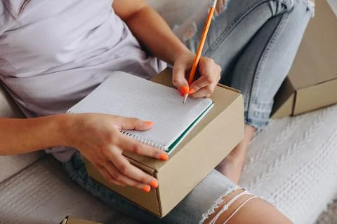Close-up of hands making notes in a notebook Stock Photos