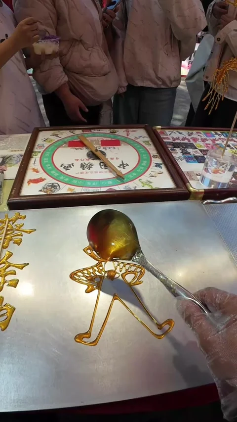 Close Up of Hands Making Traditional Chinese Sugar Painting Art China Stock Footage 339652213