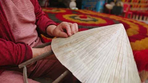 Close up of hands making traditional conical hat in a village market, showc.. Stock Footage 337001117